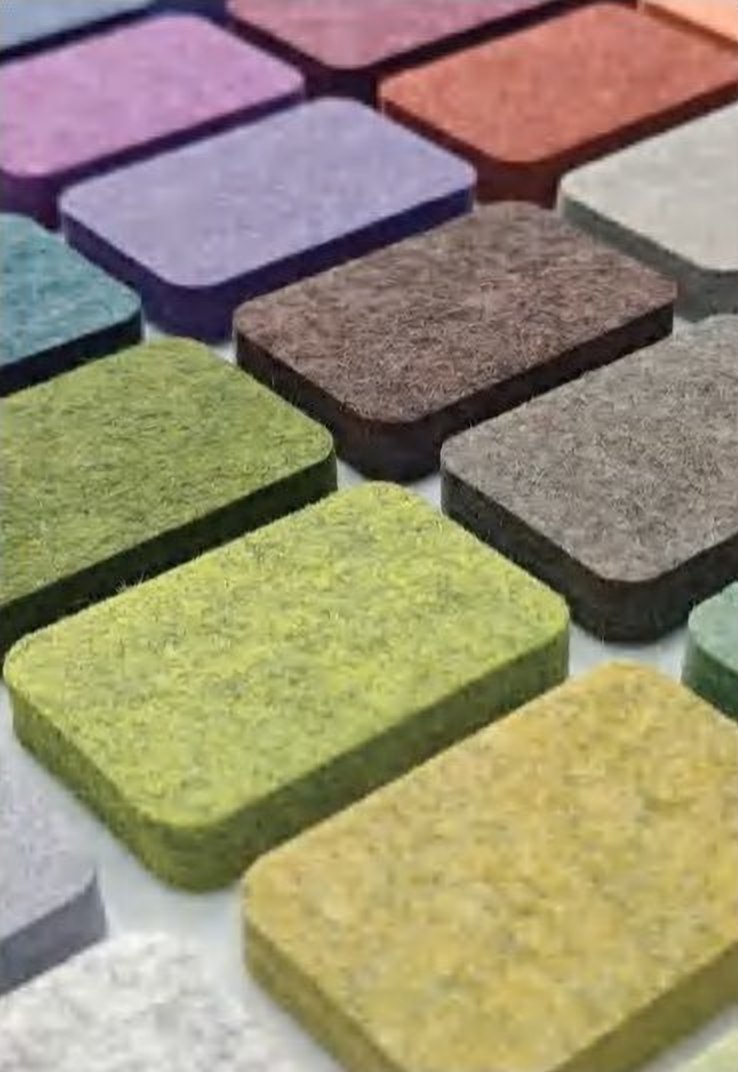 Syntric PET felt acoustic tiles stacked in many colors